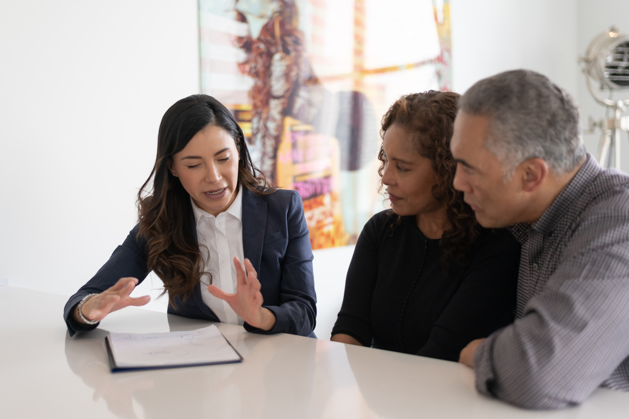 Adviser explaining a policy to a couple