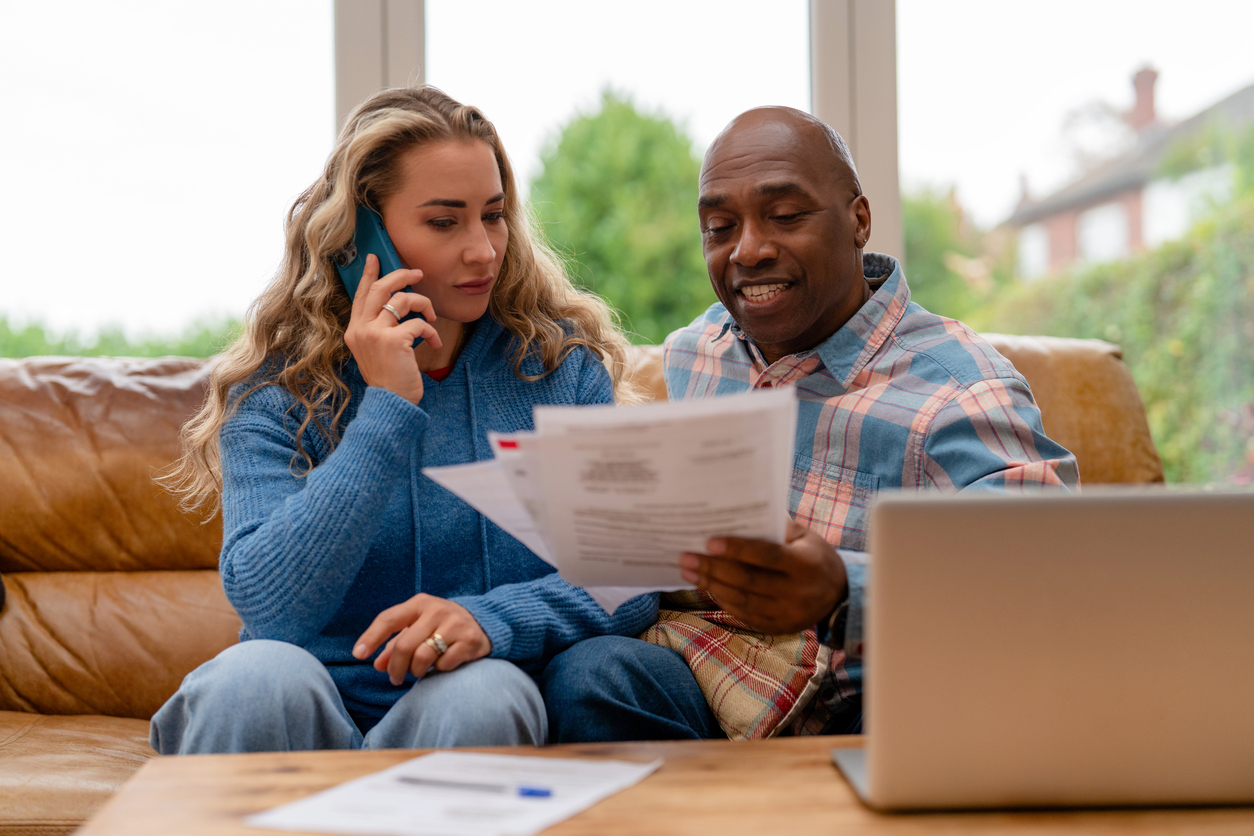 Couple reviewing a policy at home
